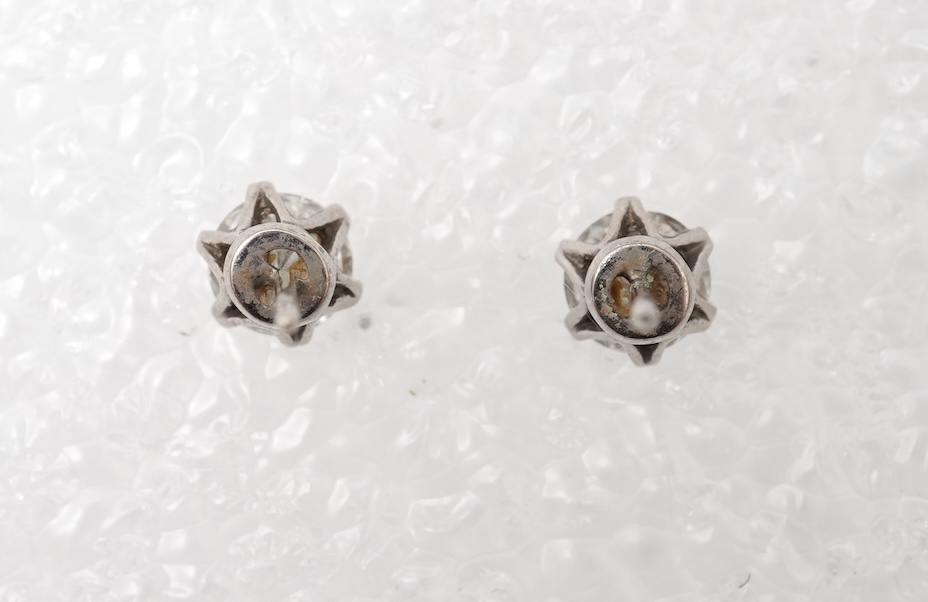 A pair of diamond stud earrings
